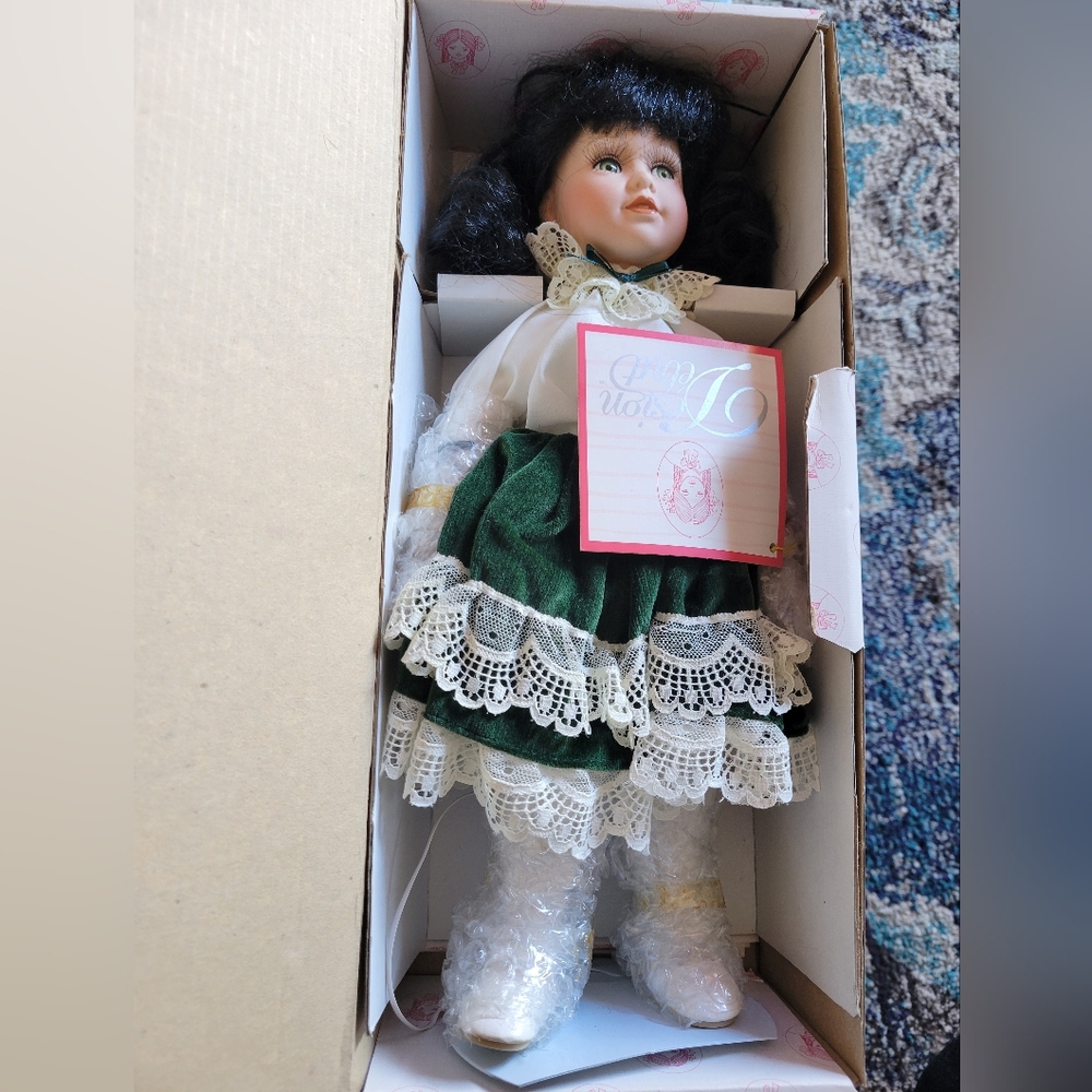 Porcelain Doll with Green Dress and Lace Details